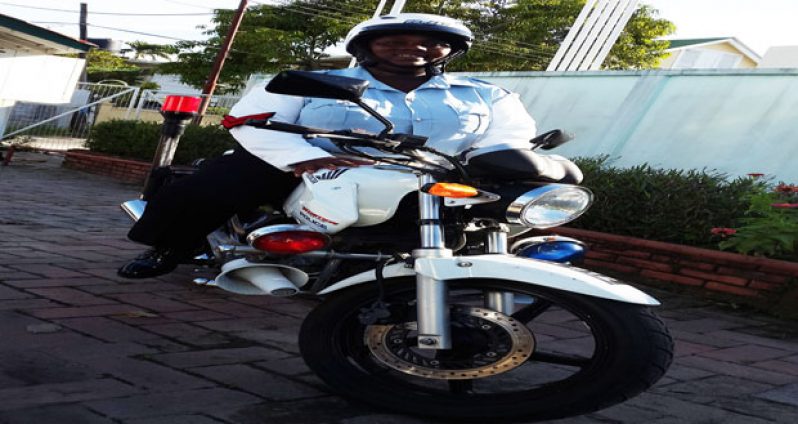 Corporal Olabesi Johnson on her GPF issue motorcycle