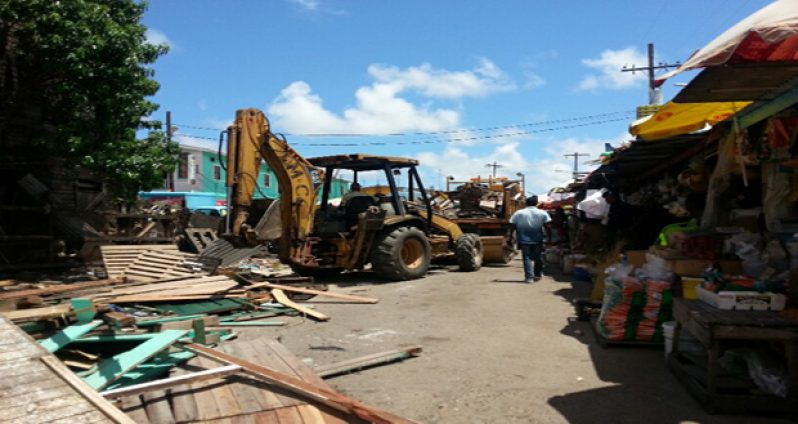 The M&CC bulldozer dismantling stalls at Bourda Market yesterday