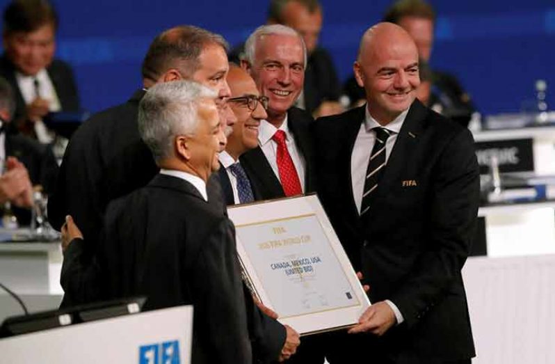 FIFA president Gianni Infantino (R) poses with officials after the announcement that the 2026 FIFA World Cup will be held in the United States, Mexico and Canada, during the 68th FIFA Congress in Moscow, Russia yesterday. (REUTERS/Sergei Karpukhin)