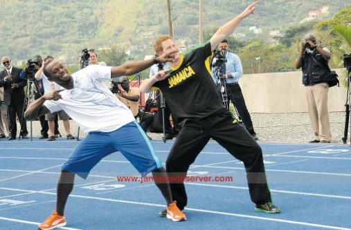 Prince Harry (right) and the world’s fastest man Usain Bolt during the Royal’s 2012 visit. (Photo: Bryan Cummings)