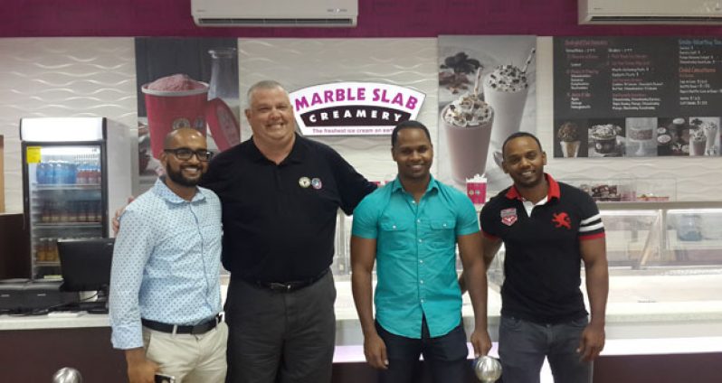 From left are: Navin Singh, Managing Director of Gravity Lounge and franchise holder of Marble Slab Creamery; Paul Probst, Marble Slab Creamery’s Franchise Business Consultant; and partners Clairmont and Dwayne Cummings