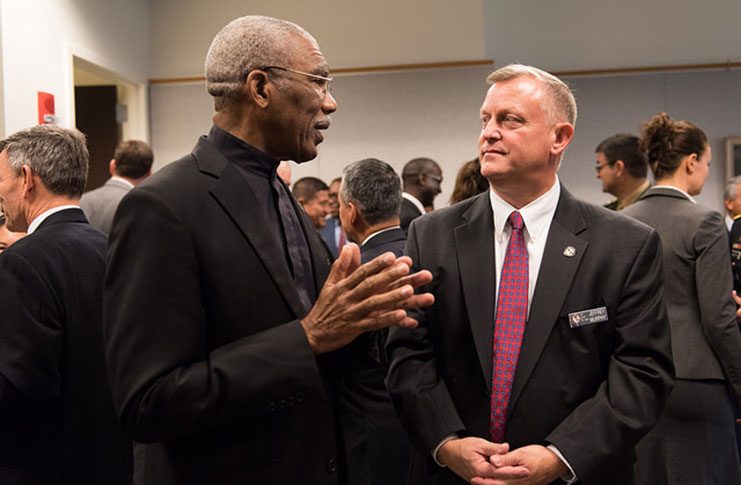 President David Granger in conversation with an official at the 20th Anniversary of the William J. Perry Center of Hemispheric Studies