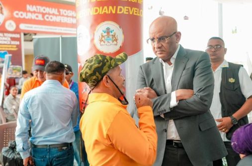 Dr. Jagdeo engaging a toshao on the sidelines of the NTC  being held at the Arthur Chung Conference Centre (ACCC)