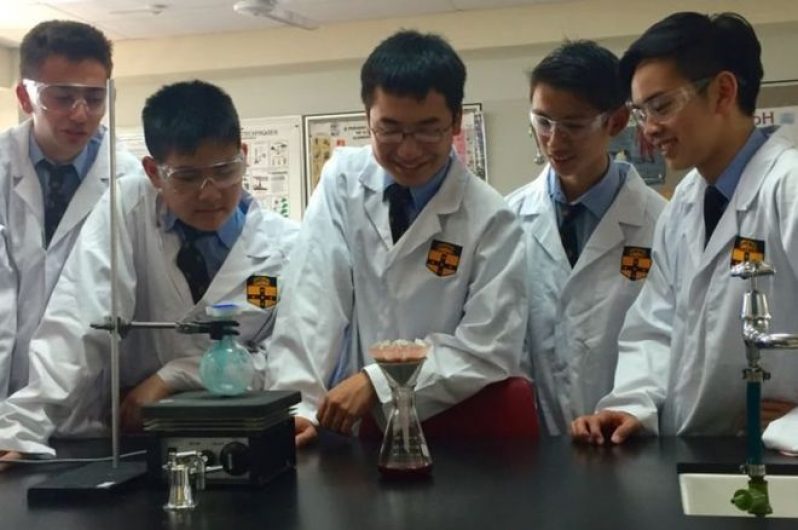 The Sydney students at work in their high school laboratory
