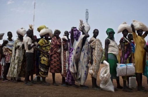 Queuing for food aid - civil war and economic collapse are being blamed