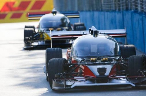 The red Devbot 1 completed the race, but the yellow Devbot 2 crashed
