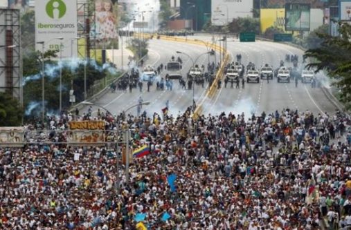 Anti-government protesters clashed with riot police in Caracas and in other cities