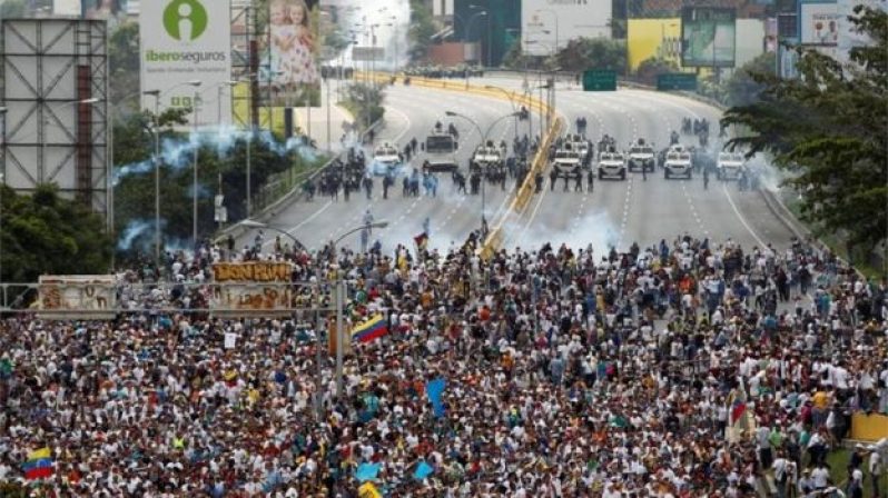 Anti-government protesters clashed with riot police in Caracas and in other cities