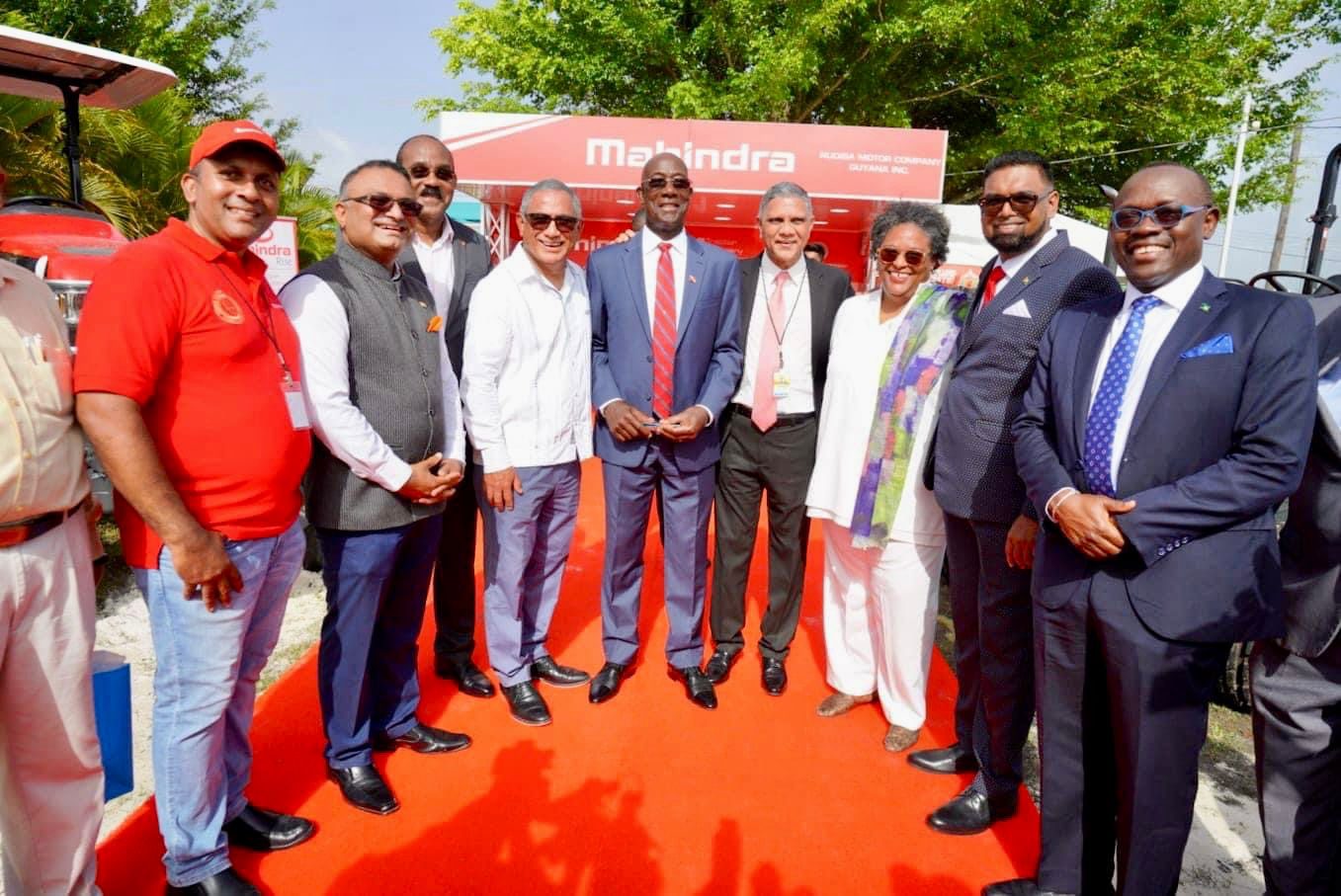 High commissioner of India to Guyana, Dr KJ Srinivasa with President Irfaan Ali and other CARICOM Head of States in front of Mahindra & Mahindra (Makers of Mahindra Tractors) at the Agri-Investment Forum and Expo