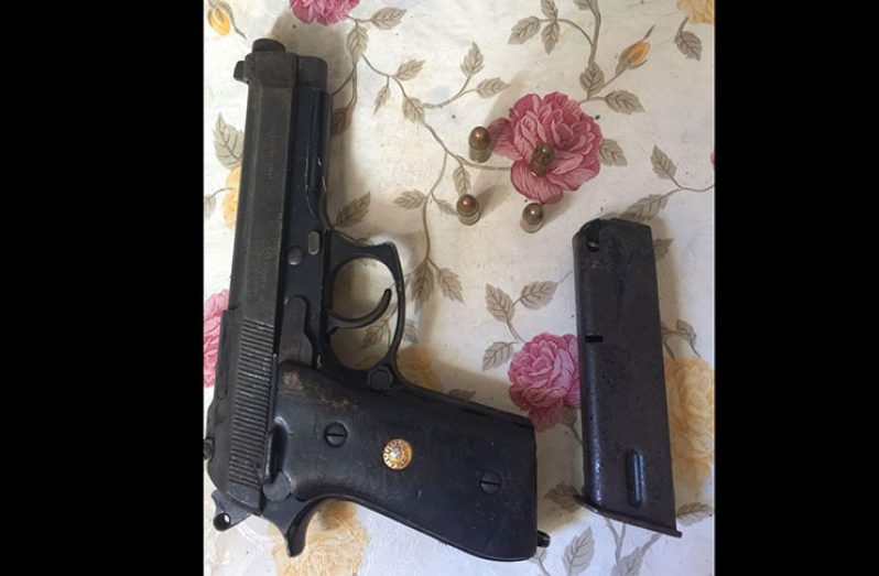 The 9mm pistol that was found in the taped parcel.