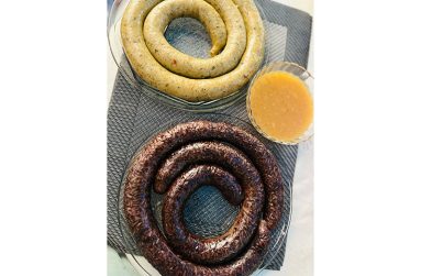 A sample of both black and white pudding with mango sour