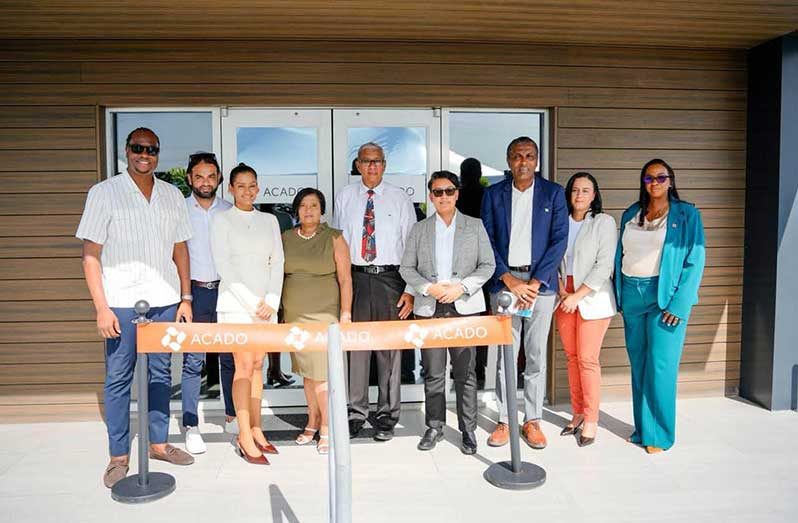 Minister of Tourism, Industry and Commerce, Susan Rodrigues, flanked by officials, during the official commissioning of ACADO Guyana Inc.’s new distribution centre on the Heroes Highway (Ministry of Tourism, Industry and Commerce photo)