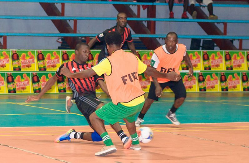 Part of the action in Magnum Mash Cup Futsal Tournament at the National Gymnasium. (Delano Williams photo)