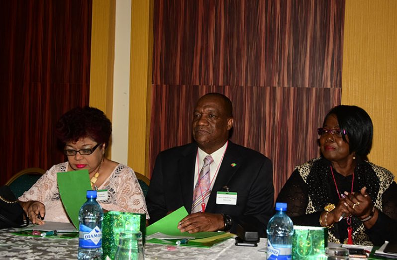 Seated from left are: Minister of Social Protection, Amna Ally; Minister of State, Joseph Harmon and Chief Executive Officer (CEO) of Zoywins Consultancy and Training Institute, Mavis Benn (Photo by Adrian Narine)