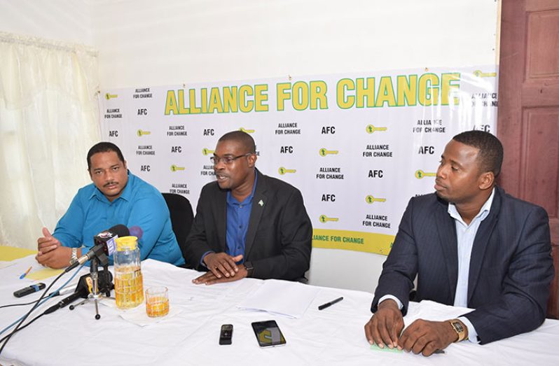 AFC General Secretary and Minister of Public Infrastructure David Patterson (centre) flanked by AFC members Trevor Williams (right) and Marlon Williams (left) at the AFC press conference on Friday