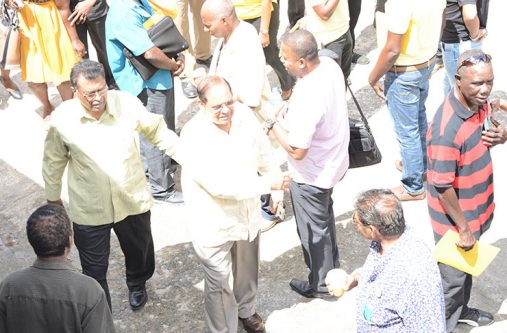 (From left) AFC top guns Khemraj Ramjattan and Moses Nagamootoo interact with supporters at the party’s 5th Biennial National Congress at the Vreed-en-Hoop Primary School