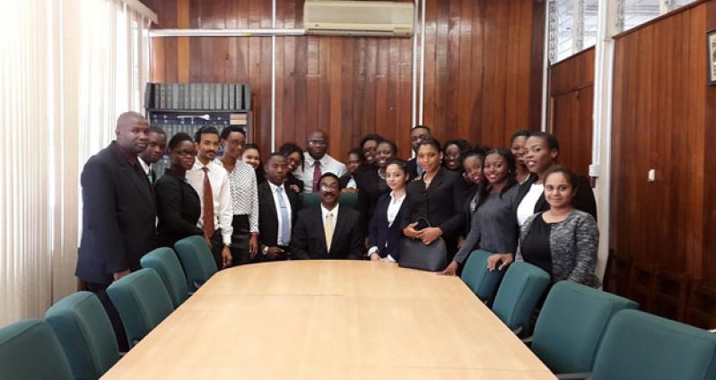 Guyanese students currently attending the Hugh Wooding Law School in Trinidad and Tobago paid a visit last week to Minister of Legal Affairs and Attorney General, Mr Basil Williams (seated at centre)