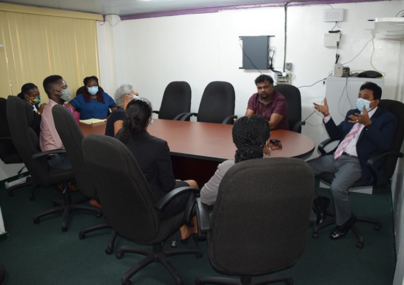 Attorney General Mohabir Anil Nandlall in discussion with staff of the IDB Criminal Justice System Programme
