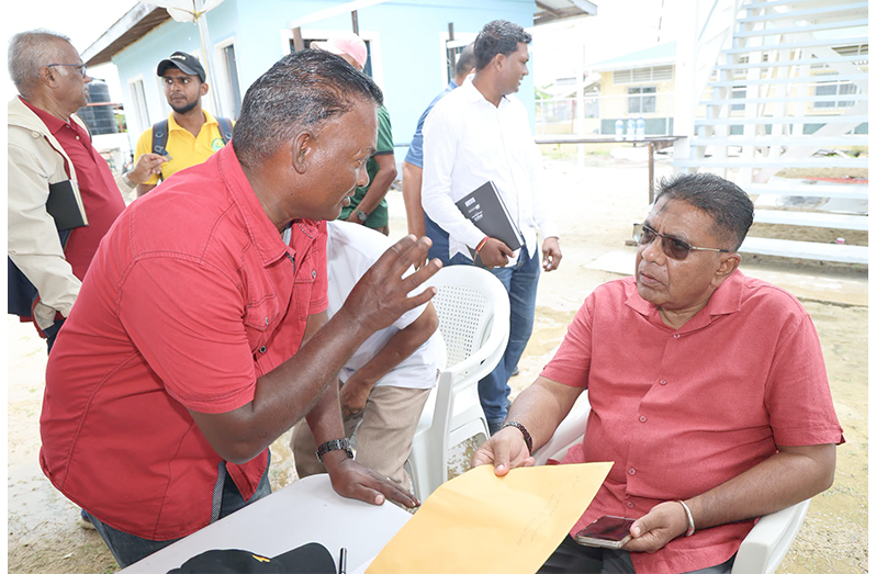 Agriculture Minister Zulfikar Mustapha listens attentively to farmers during  an engagement at Anna Regina on Saturday (MoA photos)