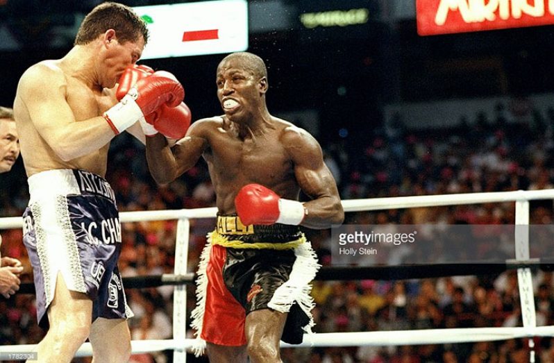 FLASHBACK: Guyana’s Terrence Alli (right) exchanges punches with legend Julio Cesar Chavez for the WBC World Super Lightweight Title. (Photo credit: Holly Stein/Allsport)