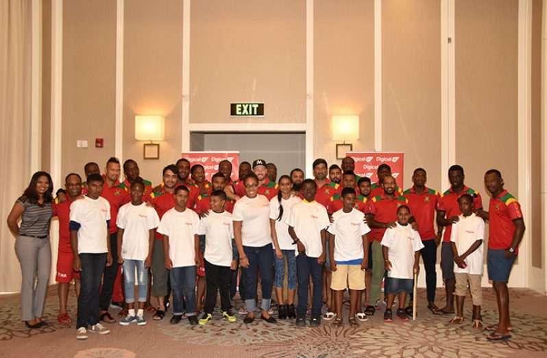 Guyana Amazon Warriors and representatives from Digicel pose for this Adrian Narine photo with children from the Diamond Special Needs School at the Marriott Hotel. (Adrian Narine photos)
