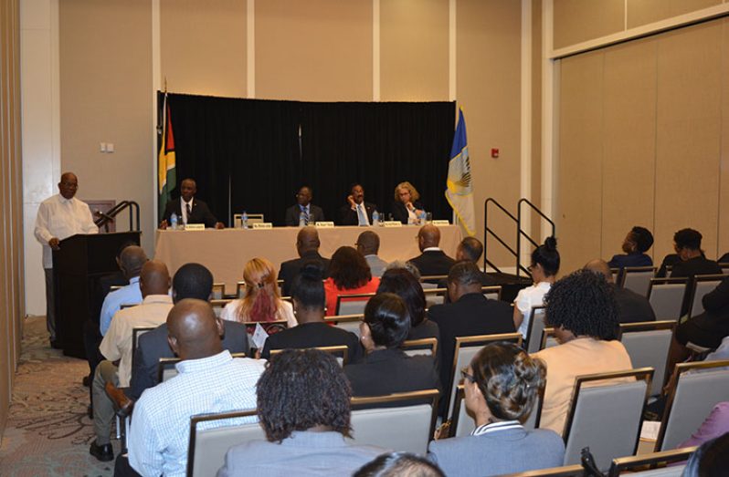 Finance Minister Winston Jordan addressing the Money Laundering and Financing of Terrorism (ML/FT) and National Risk Assessment (NRA) workshop on Wednesday. At the head-table, from left are: FIU Director Matthew Langevine; Senior Financial Sector Specialist of the World Bank,Stuart Yikona; Attorney General Basil Williams; and IDB Country Representative Sophie Makonnen