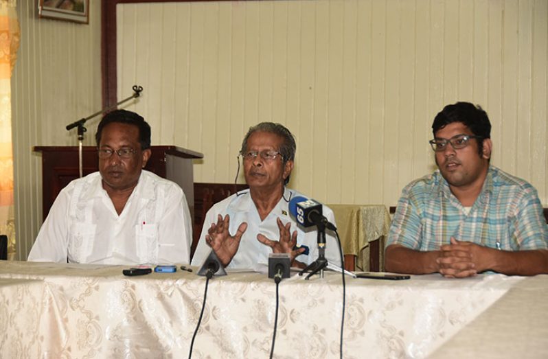 GAWU President , Komal Chand ( centre) , flanked by the union’s General Secretary , Seepaul Narine ( left) and Assistant General Secretary, Aslim Singh ( right)