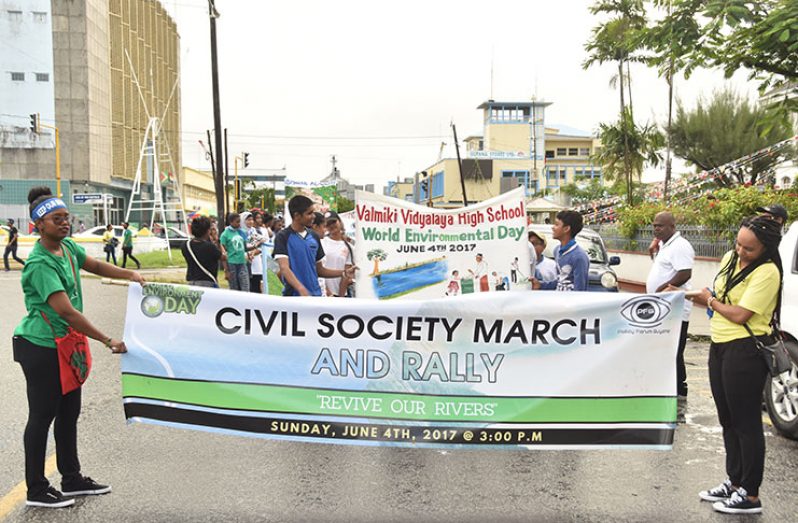 Youths get ready to march for the protection of Guyana’s rivers in observance of World Environment Day