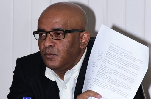 Leader of the Opposition PPP, Bharat Jagdeo displays to members of the media a copy of the proposed amendments