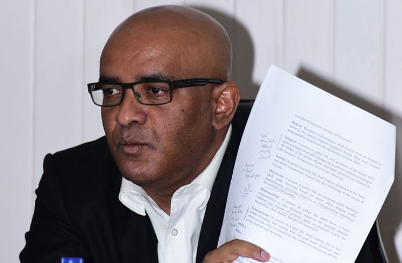 Leader of the Opposition PPP, Bharat Jagdeo displays to members of the media a copy of the proposed amendments