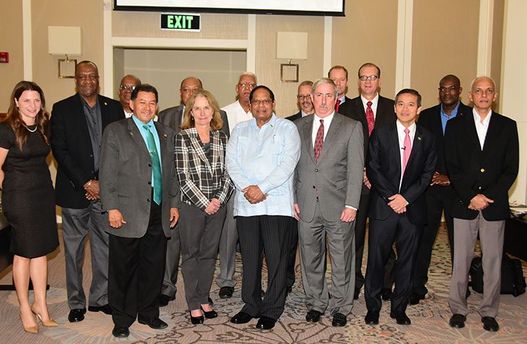 Prime Minister, Moses Nagamootoo, centre, stands alongside other Government officials including Minister of State, Joseph Harmon (second left) at the Georgetown Marriott Hotel where the Government team met officials of ExxonMobil Wednesday morning. Exxon’s Country Manager Jeff Simons is at the Prime Minister’s left (Adrian Narine photo)