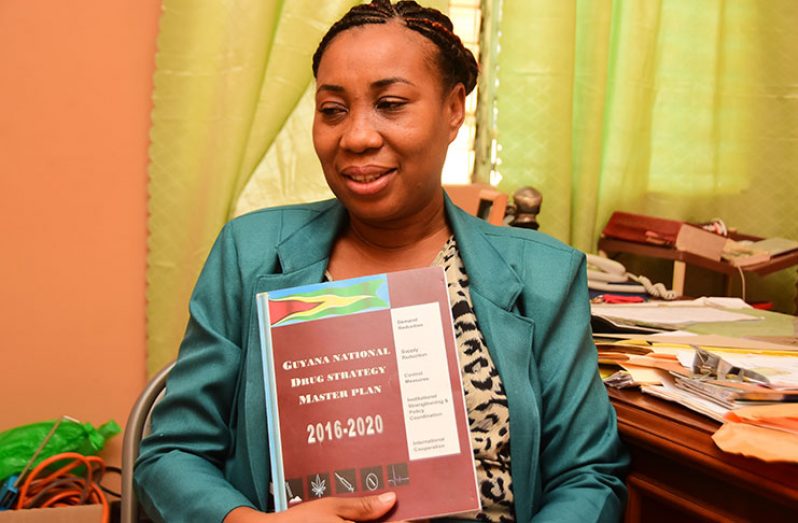 Chief Executive Officer of Phoenix Recovery Programme, Samantha Young displays a copy of the National Drug Strategic Master Plan in which she says, ’Phoenix’ is included for subvention