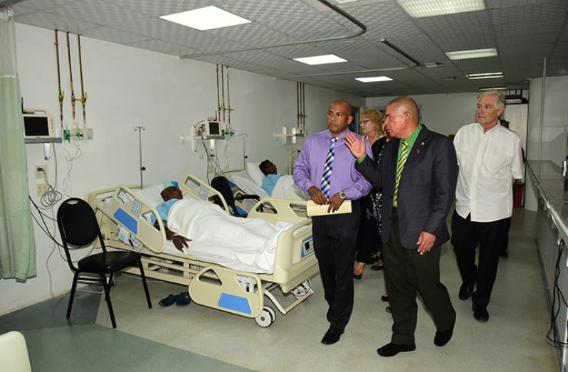 Health Minister Dr. George Norton (centre) along with Dr. Mahendra Carpen (left) and Dr. Wayne Warnica (right), doing a tour of the Cardiac Intensive Care Unit