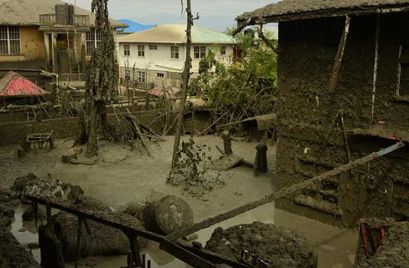 This Adrian Narine photo shows the extent of the mess and damage to property left after the natural gas had erupted.