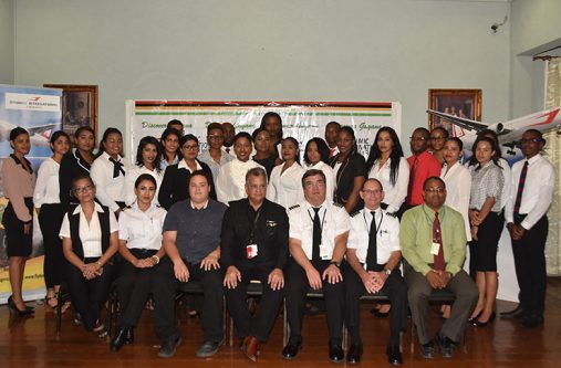Executives of Dynamic Air International and Roraima Airways with the 25 newly recruited flight attendants at Duke Lodge, on Friday. (Photo by Adrian Narine)
