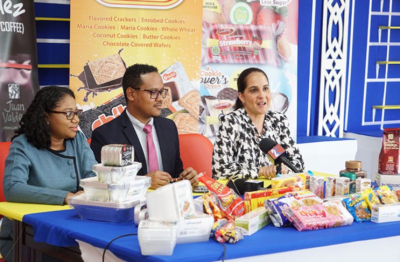 Officials of ANSA McAL display some of the products