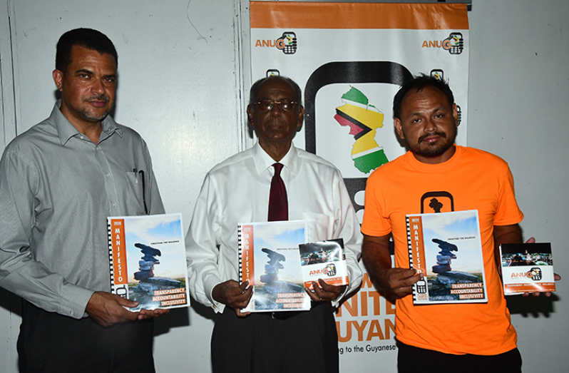 A New and United Guyana (ANUG) presidential candidate, Ralph Hari Narayen Ramkarran (centre), along with executive members of the party, Timothy Jones (left) and Mark France (right) with a copy of the party’s ‘Creating the Balance’ manifesto during the launch on Tuesday