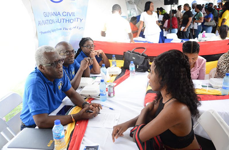 Guyana Civil Aviation Authority (GCAA) Director-General Lieutenant-Colonel (ret'd) Egbert Fields interacts with citizens (Samuel Maughn photo)