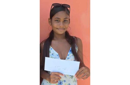 Abha Khan poses with the donation
