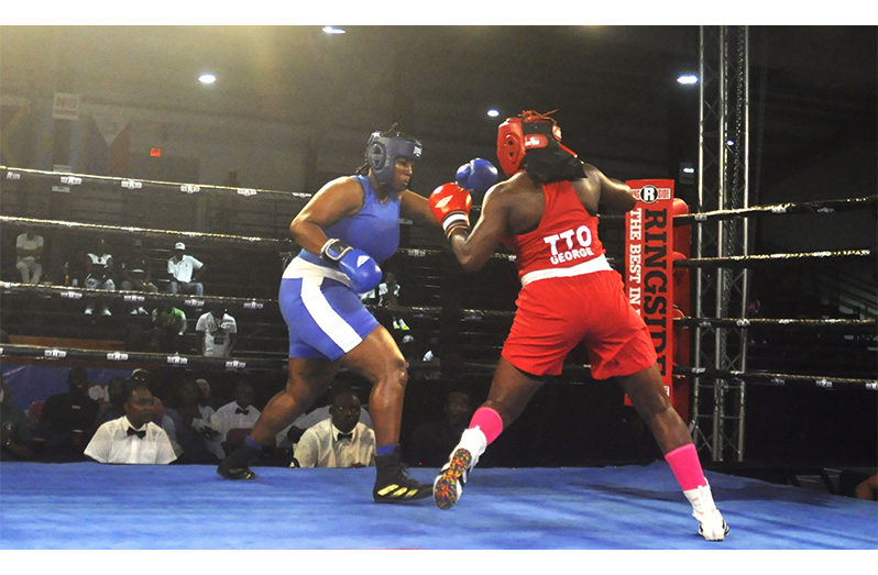 Guyana's Abiola Jackman (right) beat T&T's Angel George in a fight that could have gone either way (Sean Devers photo)
