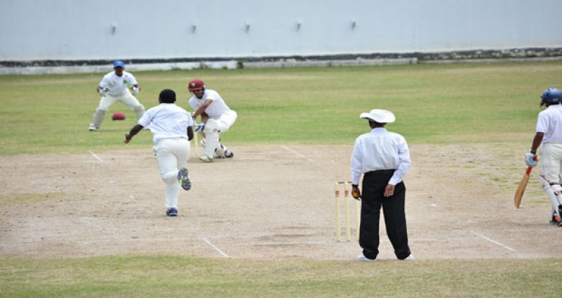 Demerara’s danger man Shurfane Rutherford bowls Berbice's Brandon Persaud, during his impressive spell in the first hour of play yesterday. (Photo by Samuel Maughn)