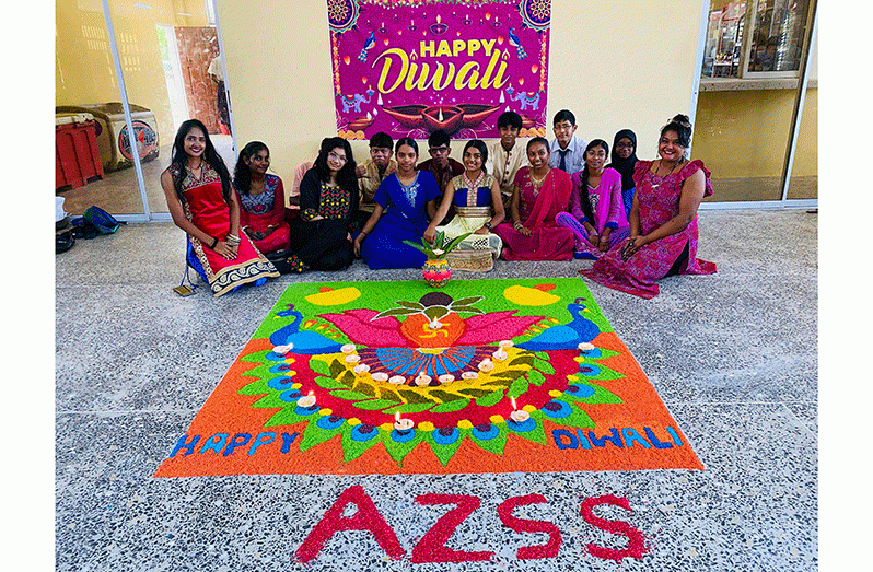 Abram Zuil Secondary School teachers and students in front of their rangoli