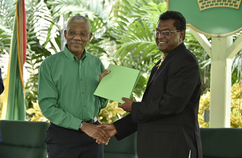 Chairman of the APNU, President David Granger and AFC’s Leader, Khemraj Ramjattan – the Minister of Public Security following the signing of the accord.