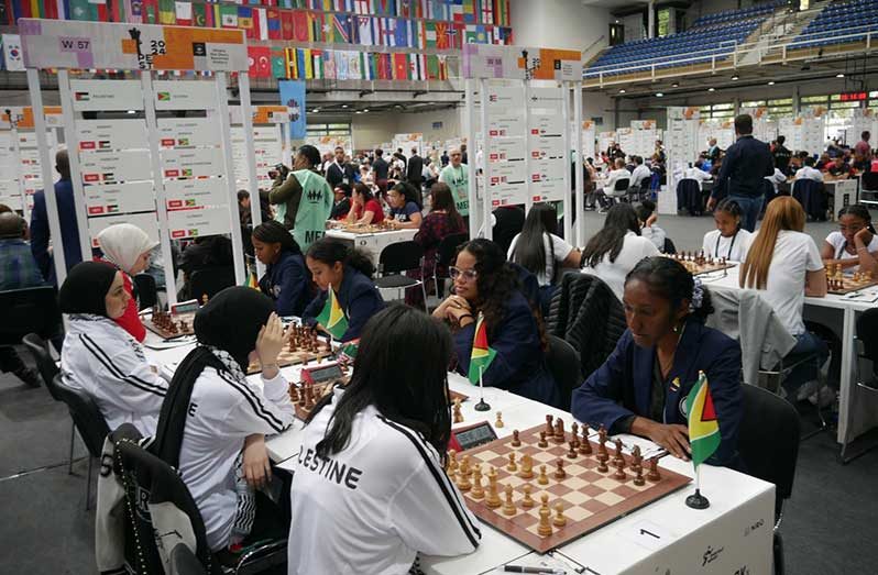 Guyana’s Women chess team in action against Palestine.