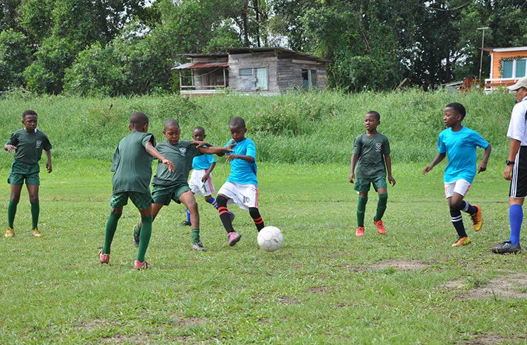 Action in the Timehri Panthers (green) and Diamond Upsetters match yesterday at the Diamond Community Centre Ground.