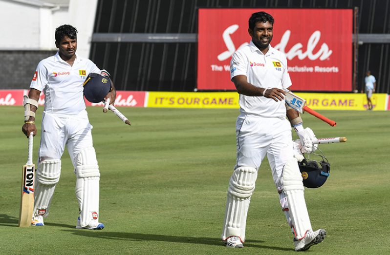Kusal Perera and Dilruwan Perera on the fourth day of the Third Test between WINDIES and Sri Lanka on Tuesday, June 26, 2018 at Kensington Oval. © CWI Media/Randy Brooks of Brooks Latouche Photography