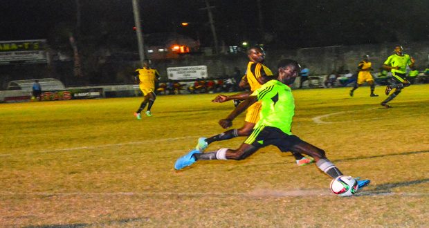 Part of the action between Police and Flamingo at the GFC ground Wednesday evening in the GFA STAG Premier League. (Samuel Maughn photo)
