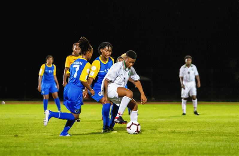 Part of the action between Suriname and St Lucia in the opening Group A match in the CONCACAF U-20 Women Championship Qualifier. St Lucia would go on to win 4-3 . (Samuel Maughn photo)