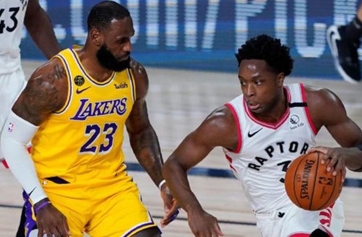 Toronto Raptors forward OG Anunoby (right) comes up against LA Lakers' LeBron James in Orlando, Florida