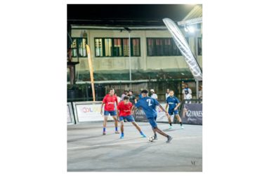 Action in Bartica’s Guinness In The Streets football on Friday night.